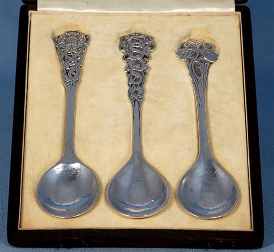 A rare cased set of three George V Arts & Crafts silver spoons, by Omar Ramsden, Length each 162mm total weight 4.8oz/150grms